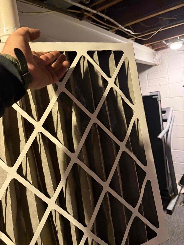 Responded to no-heat call for 6-year-old furnace that would not turn on, despite green indicator light being visible. Inspected system and discovered severely clogged air filter causing restricted airflow. Replaced dirty filter, which restored proper system operation and resolved the no-heat condition.