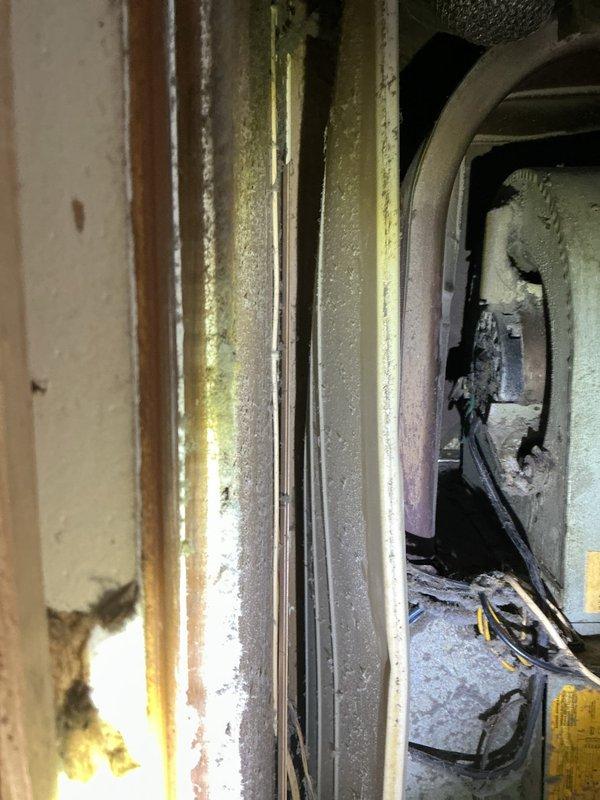 Responded to no-heat call for 2006 furnace in mobile home kitchen closet. Diagnosed flame roll-out issue occurring when inducer motor activates, caused by severe heat exchanger deterioration and corrosion as evidenced by internal inspection. Recommended complete system replacement due to age (17 years), safety concerns, and extensive heat exchanger damage beyond economical repair.