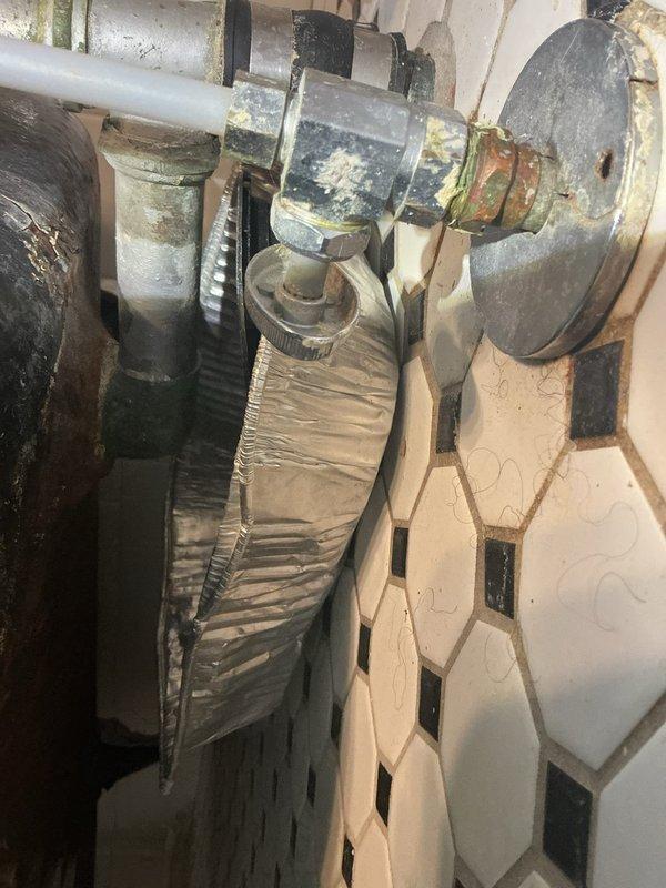 Responded to service call for water backup from floor drain. Inspected plumbing system, identifying corroded pipe connections with mineral deposits at junction points. Cleared obstruction from drain line, restoring proper drainage function and preventing further water backup issues.