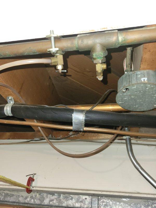 Performed diagnostic assessment on non-operational 33-year-old furnace with confirmed cracked heat exchanger in basement location. Documented corrosion and oxidation on copper piping with visible green patina formation. Presented replacement options to customer including: 1) furnace only, 2) furnace and AC combination, or 3) complete system upgrade with furnace, AC, and generator.