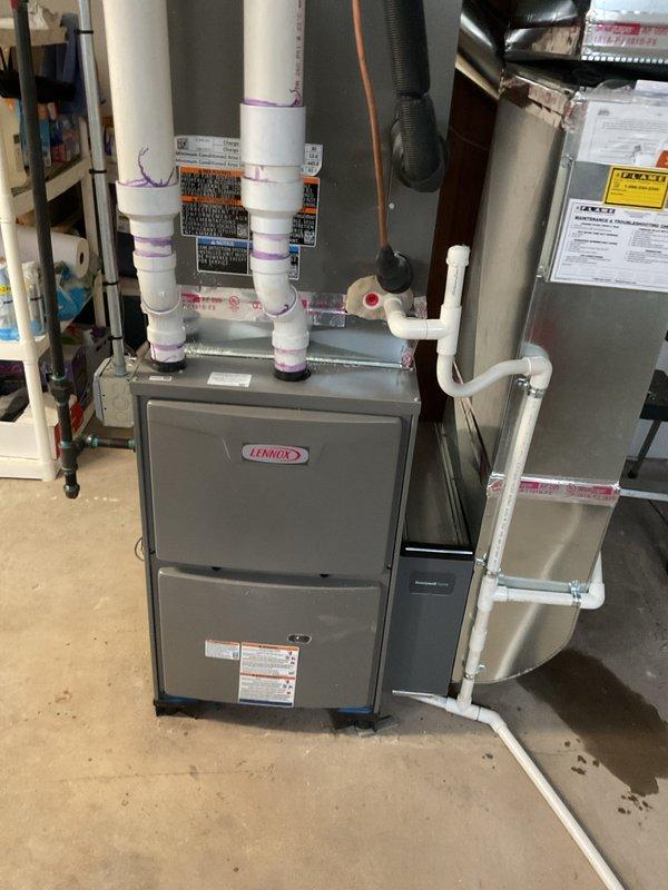 Successfully installed a new 90,000 BTU Lennox furnace with all necessary connections and components. Installation included proper venting with PVC pipes, electrical reconnection to the main panel, and addition of a humidifier system. All work was completed with required mechanical and electrical permits, and the system qualifies for utility rebate program.