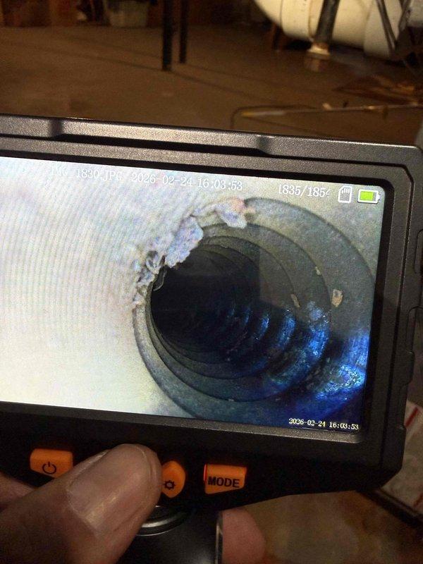 Responded to customer call regarding non-functional furnace with suspected carbon monoxide leak. Inspection using borescope revealed extensive interior rust and corrosion throughout the heat exchanger and blower assembly. Furnace determined to be unsafe for operation due to compromised heat exchanger integrity, presenting significant carbon monoxide risk.