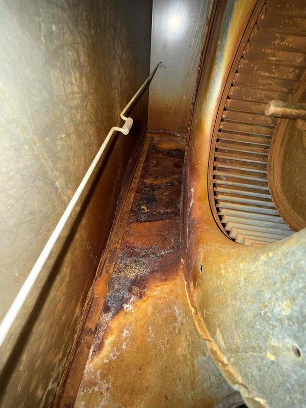Responded to customer call regarding non-functional furnace with suspected carbon monoxide leak. Inspection using borescope revealed extensive interior rust and corrosion throughout the heat exchanger and blower assembly. Furnace determined to be unsafe for operation due to compromised heat exchanger integrity, presenting significant carbon monoxide risk.