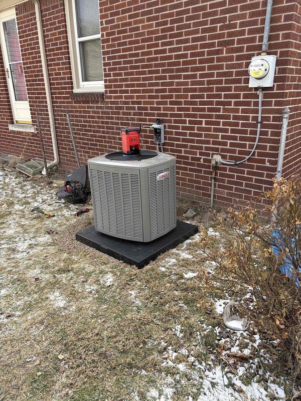 Successfully installed a complete HVAC system including a 70,000 BTU furnace, 2-ton AC unit with outdoor condenser (positioned in rear yard on proper pad), 500m humidifier, and programmable thermostat. All mechanical and electrical connections were properly completed according to code requirements, with the outdoor unit properly mounted against the brick exterior wall with appropriate clearances. System was fully tested and verified operational with all permits secured.