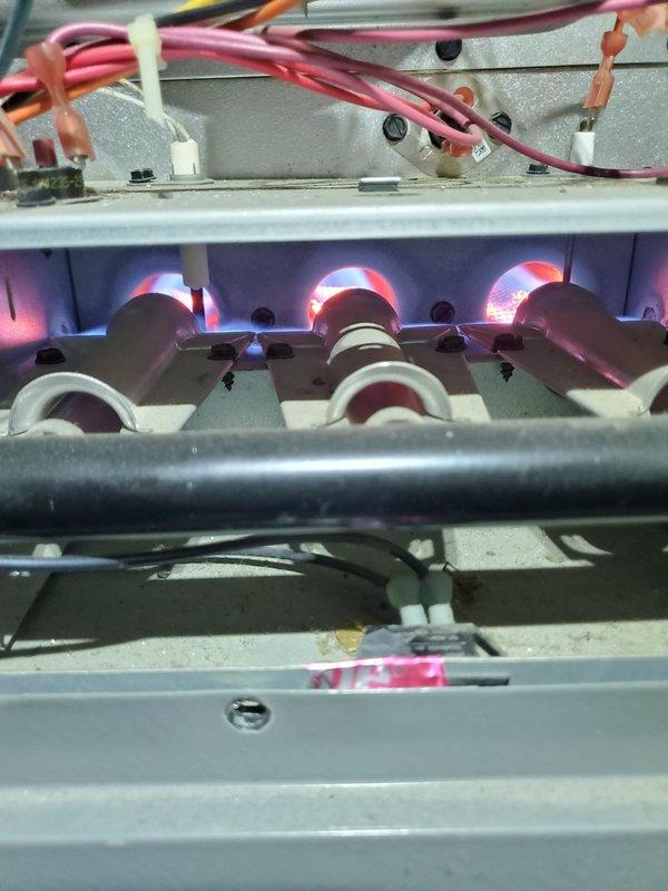 Responded to no heat complaint at rental property where system was blowing cold air. Performed diagnostic inspection of gas furnace and found unit operating properly with burners igniting correctly and normal flame pattern observed. Verified proper gas supply, electrical connections, and airflow through the system. No issues found during service call; system now heating effectively.