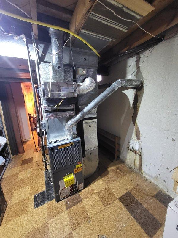 Inspected 15-year-old furnace system in basement that was heating inconsistently. Identified leaking inducer motor and multiple additional operational issues. Provided comprehensive replacement estimate for both furnace and AC systems to restore reliable heating and cooling functionality.