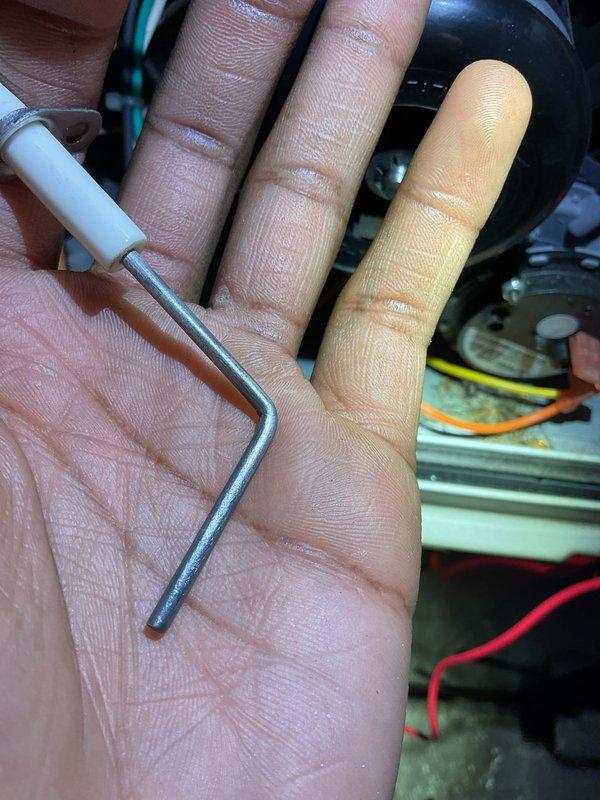 Completed Gold Furnace Inspection on 5-year-old forced air system located in basement. Inspected unit for proper operation, performed routine maintenance using hex tool to adjust components, and examined electrical connections including visible red and yellow wiring. System is functioning within normal parameters.