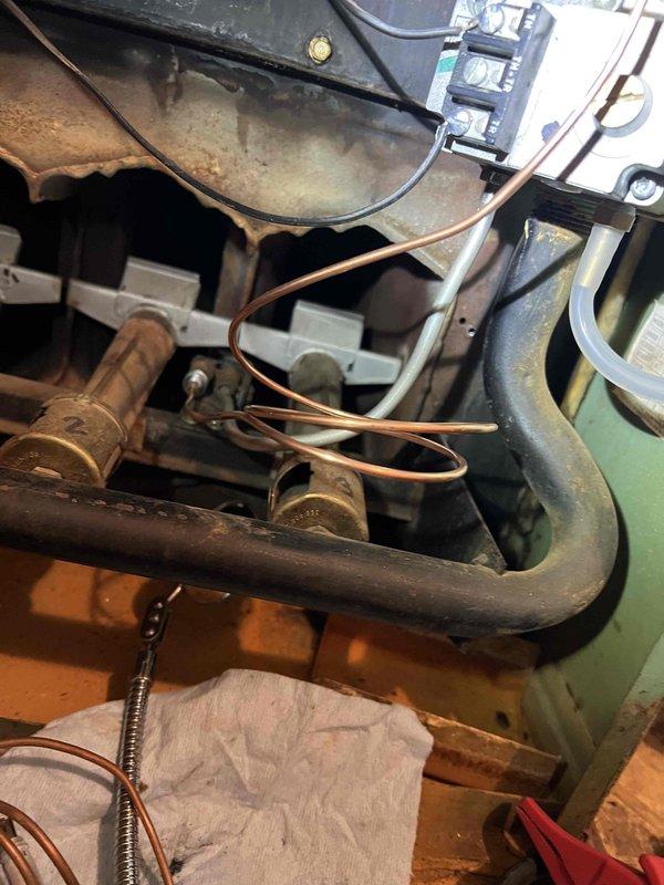 Performed furnace inspection on unit of unknown age located in laundry room, including examination of the gas valve system. Inspected and documented condition of internal components showing signs of age and corrosion. Comprehensive tune-up included checks of humidifier, thermostat, and hot water tank.