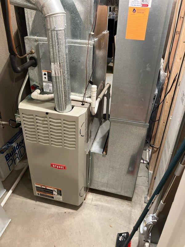 Completed assessment of 23-year-old Bryant furnace and AC system for potential replacement. Inspected existing installation in basement utility area, including connected ductwork, GeneralAire humidifier (model GF-13 for models 1042/1137), and PVC condensate drainage system. Documented current equipment condition and layout to prepare comprehensive replacement estimate for both heating and cooling components.