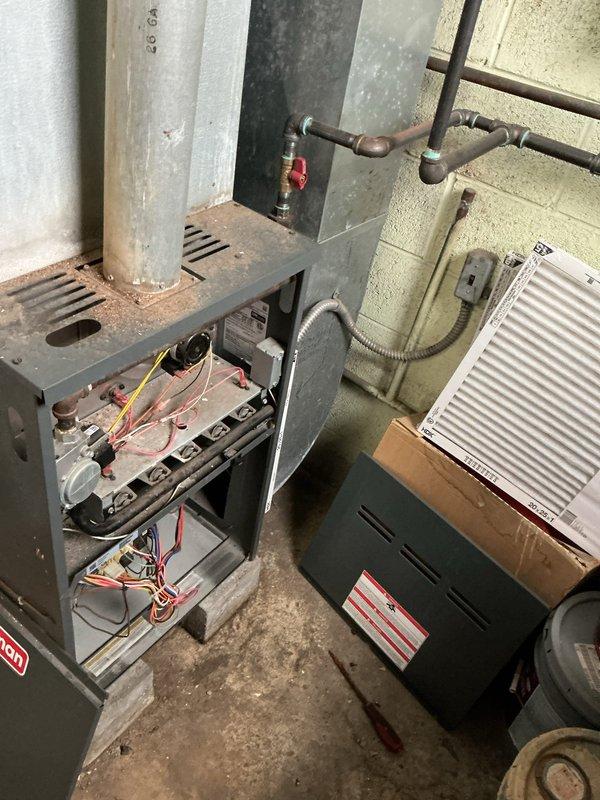 Responded to callback for a hot water tank installation from previous day where heating system stopped functioning. Inspected furnace and found thermostat wires had been disconnected during water heater installation. Reconnected appropriate wiring to control board, tested system operation, and confirmed proper heating function was restored. System is now operating normally.