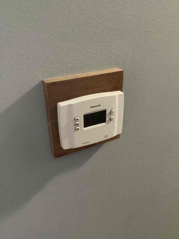 Performed diagnostic on 23-year-old furnace with failed inducer motor. Inspected existing thermostat and basement installation. Presented replacement options to customer as repair costs exceeded $1300, with customer preferring full system replacement over repair.