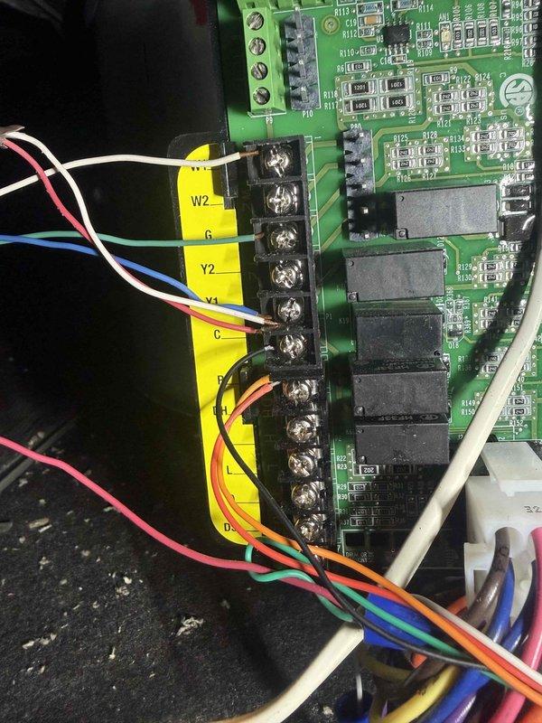 Responded to callback for thermostat malfunction and furnace noise concerns following recent furnace and A/C installation. Inspected control board circuitry and terminal connections, finding loose wiring at the terminal block. Secured all connections and verified proper operation of the system. Unit is now functioning normally with no unusual noise.