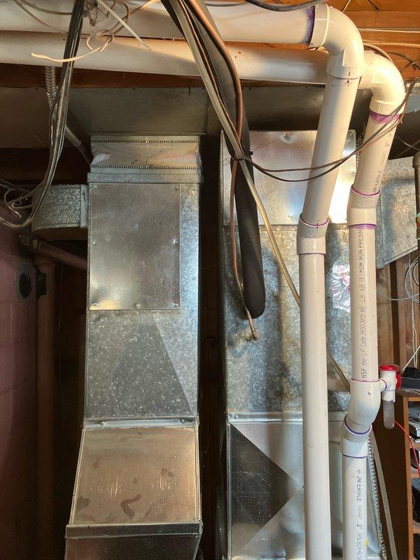 Performed diagnostic assessment on 10-year-old York furnace with failed heat exchanger located in basement. Inspection revealed unit turning on/off intermittently accompanied by abnormal noises. Replacement recommended as repair costs for failed heat exchanger would be substantial, with installation requiring proper ductwork integration and PVC venting system modifications in the confined utility space.