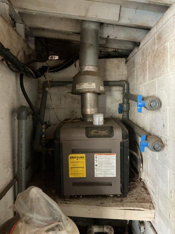 Responded to a service call regarding a water leak. Upon inspection, found ceiling damage with exposed ductwork and piping visible through an opening in the drywall. Determined the source to be a disconnected pipe near the furnace/boiler system in the utility room, which was not directly attached to the HVAC equipment. Advised customer that plumbing repairs would be necessary to resolve the issue completely.