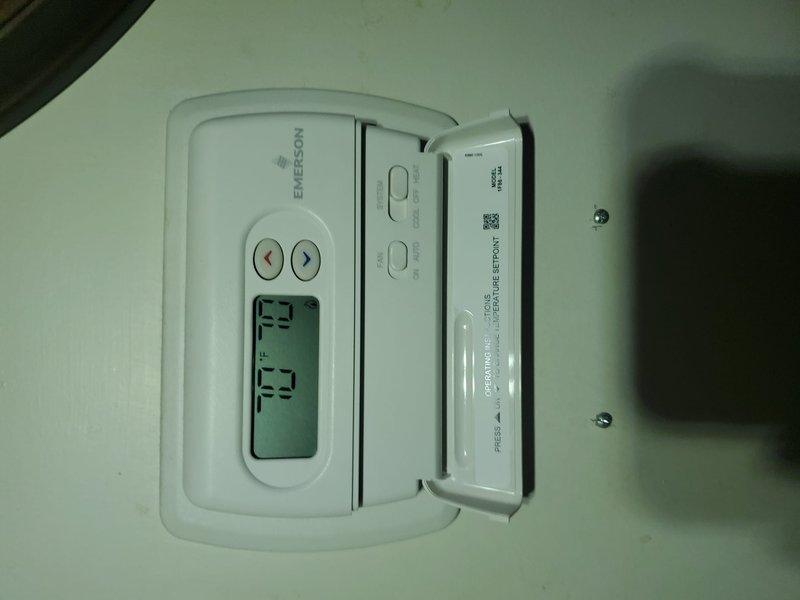 Diagnosed intermittent heating failure on Emerson thermostat-controlled system that was shutting down during windy conditions. Inspected furnace installation and ductwork in basement, finding proper component installation with no visible damage. Resolved issue by adjusting thermostat programming and verifying system operation through complete heating cycle.