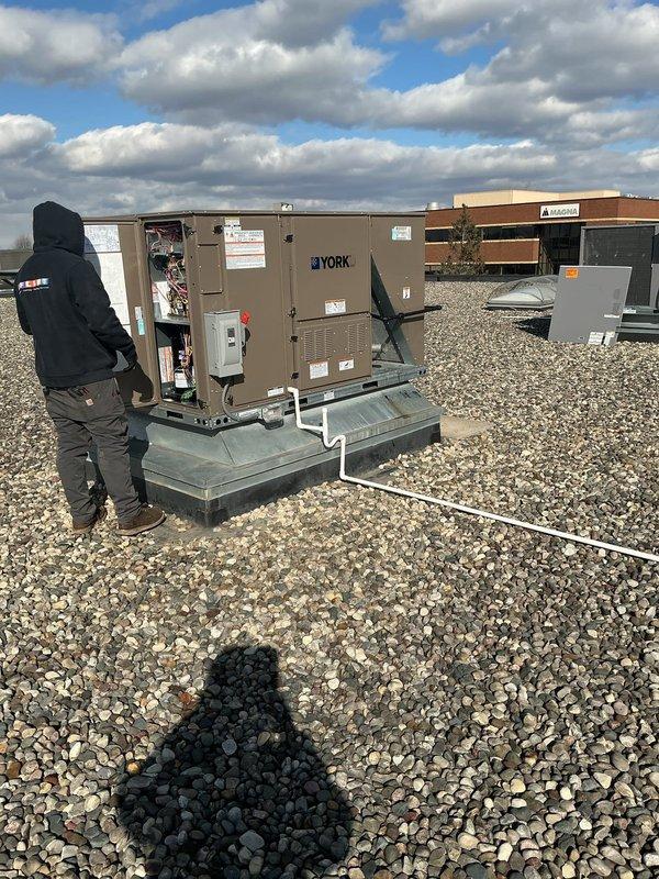 Successfully removed and replaced RTU #3 and #4 with new York units on commercial property, reusing existing smoke detection equipment while updating disconnects and GFI. Installation was completed using a 40-ton crane with Big Blue stats maintained for system performance.