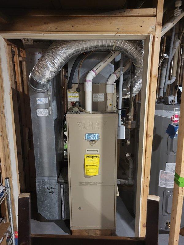 Conducted assessment of 26-year-old York furnace with improper repair work performed by previous company. Identified damaged ignitor mounting bracket (now obsolete) and incorrectly installed "hot rod" ignitor incompatible with this model. Presented replacement options for both furnace-only and complete furnace/AC system replacement to address reliability concerns with aging equipment.