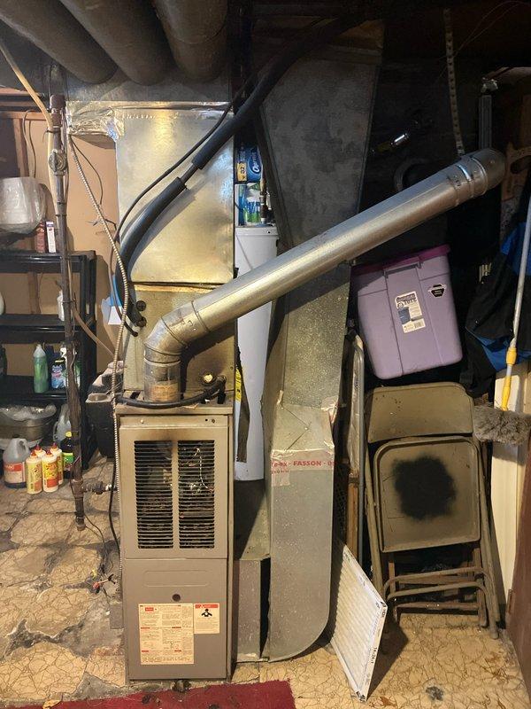 Performed diagnostic assessment on 15+ year-old furnace that failed to maintain operation long enough to heat the residence despite previous repair attempts by another company (inducer motor and gas valve replacement). Inspection revealed a failed blower motor that only activates upon furnace overheating, producing screeching noises and burning odor when operational. Recommended complete system replacement due to age and multiple component failures.