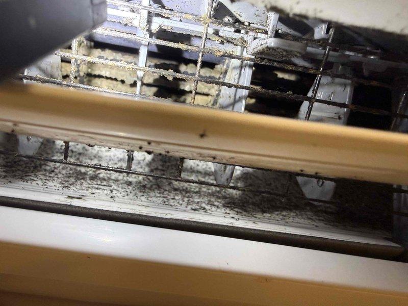 Responded to service call for Mitsubishi PKA-A36KA74y split system heat pump not producing cold air. Diagnostic check revealed error code displayed on the wall controller and significant debris buildup in the ventilation system. Cleaned accumulated dirt from air return grid to restore proper airflow and reset system, resolving the cooling issue.