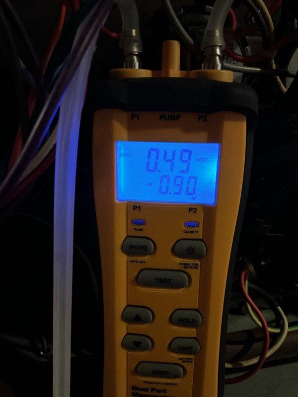 Responded to callback for furnace cycling issue. Performed pressure switch diagnostics using manometer, obtaining readings of 0.49/0.26 VAC and -0.90/-0.48 inWC across P1/P2 ports. Verified proper operation of pressure switches and confirmed system is now functioning normally.