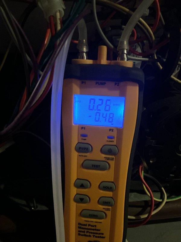 Responded to callback for furnace cycling issue. Performed pressure switch diagnostics using manometer, obtaining readings of 0.49/0.26 VAC and -0.90/-0.48 inWC across P1/P2 ports. Verified proper operation of pressure switches and confirmed system is now functioning normally.
