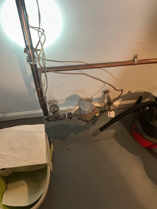 Conducted diagnostic assessment of customer's gas meter valve setup to determine compliance requirements for city code approval. Inspected existing plumbing configuration including copper supply lines, connection points, and valve mechanism. Documented current installation with photos to develop appropriate remediation plan for bringing gas meter valve up to required municipal code specifications.