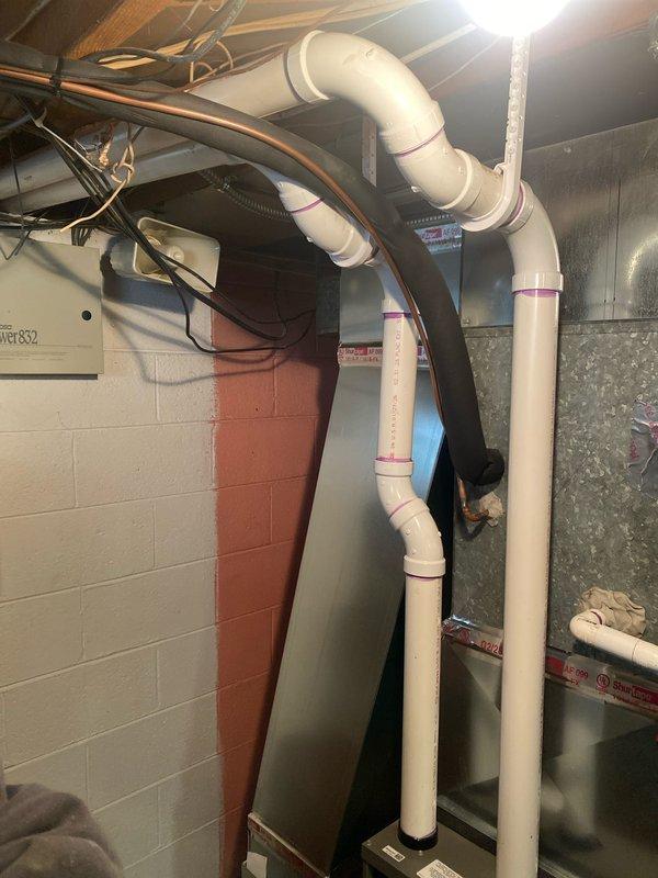 Successfully completed furnace installation (70,000 BTU) with all required mechanical and electrical connections. Installed new PVC venting system with proper joints and connections, visible in the utility area with appropriate clearances. All components were properly secured and connected to existing ductwork with permits obtained for mechanical, electrical, and reconnection work.