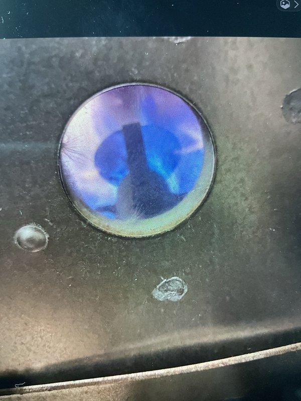 Replaced aging 14-year-old White-Rodgers thermostat with new unit as requested under Gold Plan service. Verified proper system operation after installation, confirming normal flame pattern in furnace and accurate temperature control at 72 degrees.