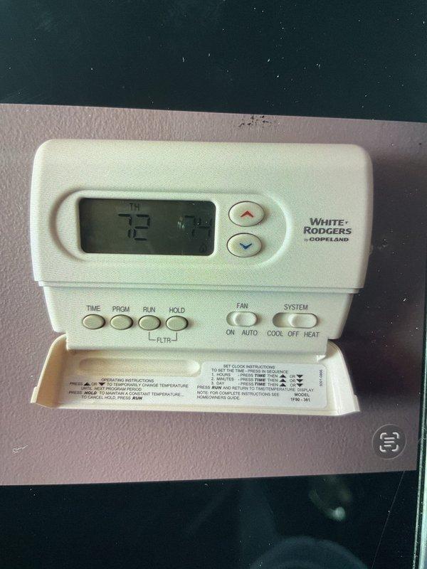 Replaced aging 14-year-old White-Rodgers thermostat with new unit as requested under Gold Plan service. Verified proper system operation after installation, confirming normal flame pattern in furnace and accurate temperature control at 72 degrees.