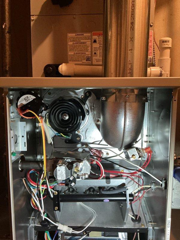 Responded to service call for intermittent furnace operation (cycling on and off). Upon inspection of the Rheem HVAC system located in basement, performed comprehensive diagnostic testing of all components including blower motor assembly, electrical connections, and safety controls. System was operational during visit with no active faults detected; documented current condition with photos of internal components and installation configuration for future reference.