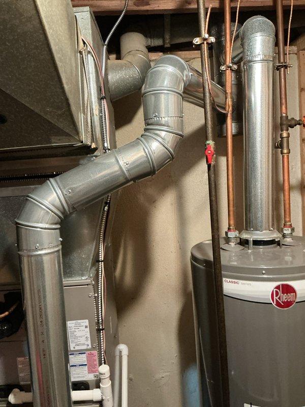 Responded to service call for intermittent furnace operation (cycling on and off). Upon inspection of the Rheem HVAC system located in basement, performed comprehensive diagnostic testing of all components including blower motor assembly, electrical connections, and safety controls. System was operational during visit with no active faults detected; documented current condition with photos of internal components and installation configuration for future reference.