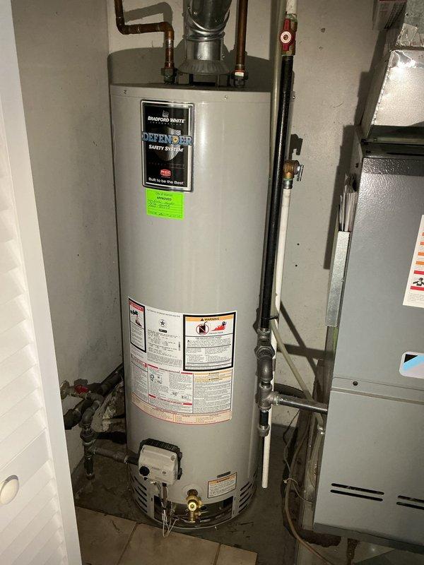 Diagnosed and serviced Bradford White water heater (installed 9/2020) experiencing intermittent pilot light failure. Inspected gas supply, thermocouple, and pilot assembly, finding carbon buildup affecting proper ignition. Cleaned components, adjusted pilot flame, and verified stable operation after repair. Unit is now functioning properly under existing warranty.