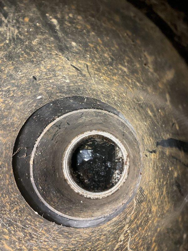 Cleared significant blockage from washing machine drain line that was causing backup issues. Visual inspection revealed accumulated sediment and mineral deposits in the cast iron pipe, with notable rust streaks and buildup along interior walls. Service restored proper drainage function.