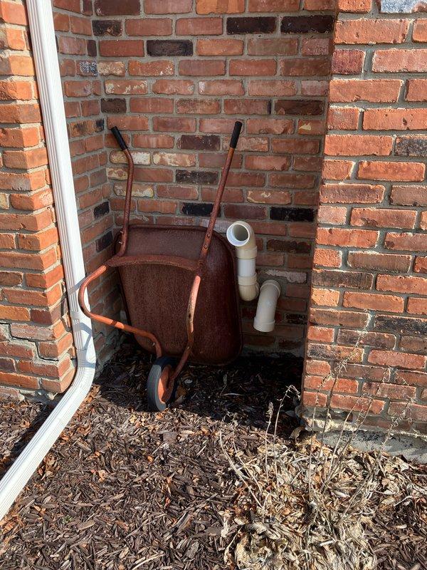 Conducted assessment of non-functioning 10+ year old AC unit and possible furnace replacement in basement location. Inspection revealed outdoor unit (currently covered with protective tarp) showing significant age deterioration and connected to natural gas supply. Recommended complete system replacement to restore cooling functionality and improve energy efficiency.