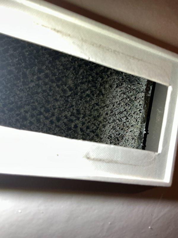 Performed comprehensive tune-up on 16-year-old HVAC system located in basement. Inspection revealed a heavily soiled air filter requiring replacement and significant corrosion/mineral buildup at the hot water tank connection point with evidence of possible leakage. System assessment included thorough examination of humidifier, thermostat, and hot water tank as specified.