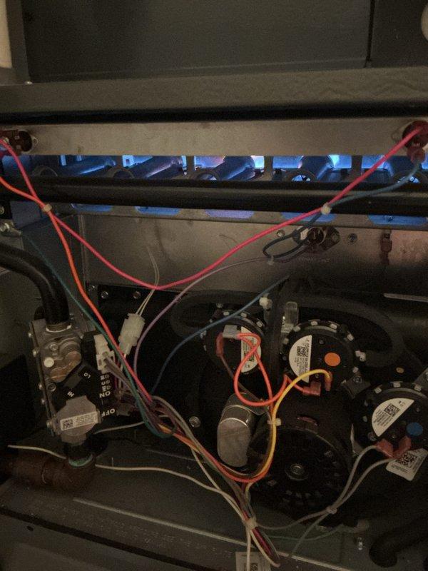 Performed Gold Furnace Inspection on two residential units - one located in basement and one upstairs, both under 10 years old. Inspection revealed both systems are operational with proper blue flame combustion and no visible issues with gas valves, pressure switches, or electrical components. Visual examination of blower motors and control boards showed normal operation.