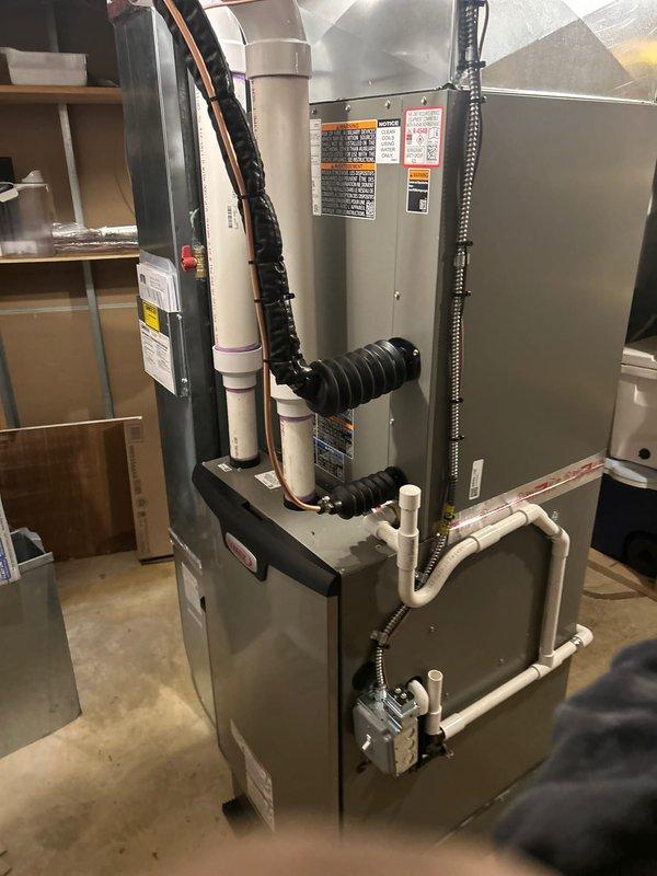 Successfully completed installation of a complete HVAC system including a 110,000 BTU furnace, 4-ton AC unit, and whole-home humidifier with proper mechanical and electrical connections. System features a Lennox S40 smart thermostat with humidity control and temperature monitoring capabilities, and all necessary ductwork was properly connected with appropriate PVC venting installed according to manufacturer specifications.