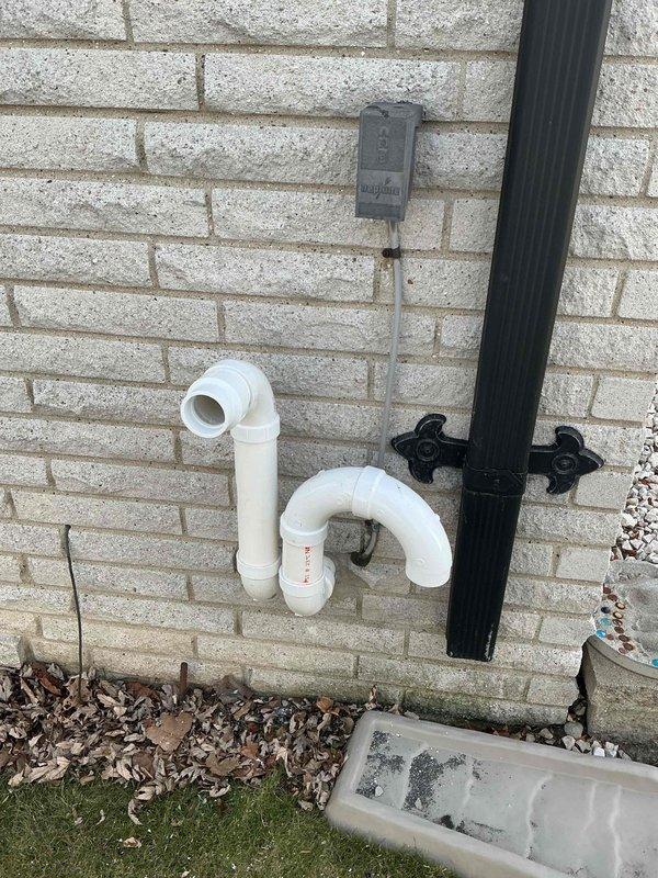 Completed installation of a 70,000 BTU furnace with mechanical and electrical connections. System was properly vented with PVC piping secured to ceiling joists, and exterior drainage was configured with appropriate P-trap assembly. Michigan Saves financing was secured and consumer rebate documentation was processed.