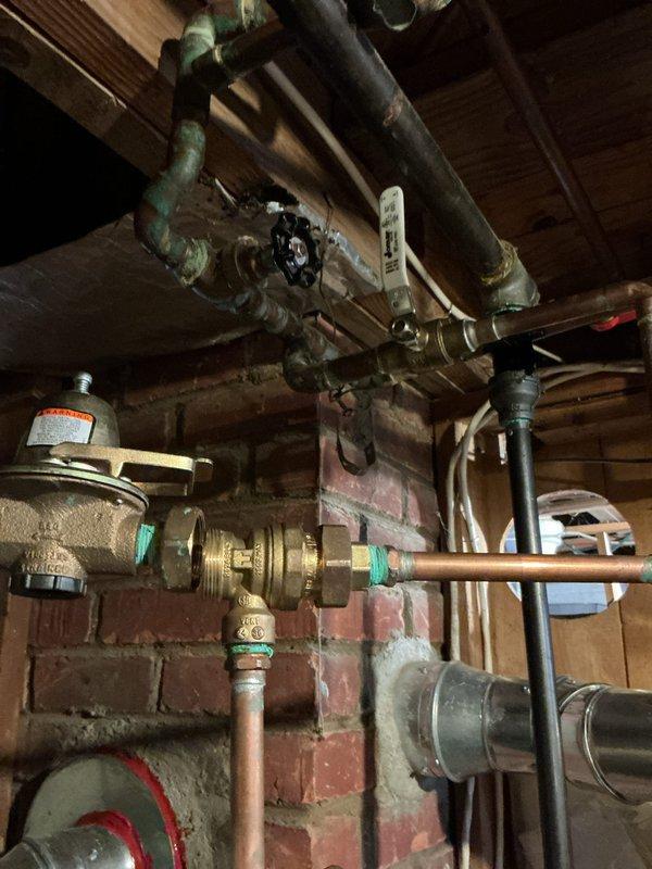 Responded to warranty service call for furnace making loud noise since installation (under 2 years old). Inspected plumbing infrastructure in basement including pipe network, valves, and connections. Parts requiring replacement were collected and transported to shop for processing under active parts and labor warranty.