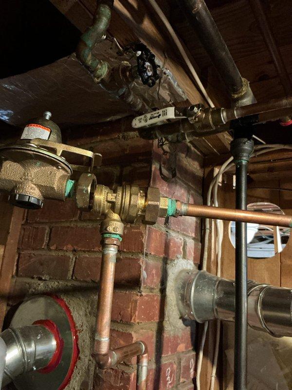 Responded to warranty service call for furnace making loud noise since installation (under 2 years old). Inspected plumbing infrastructure in basement including pipe network, valves, and connections. Parts requiring replacement were collected and transported to shop for processing under active parts and labor warranty.