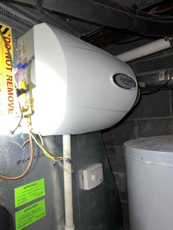 Replaced aging water heater in basement of 80-year-old home where persistent leak had been occurring for several weeks. Installed new unit with proper copper piping connections and verified operation of associated AprilAire system. All work completed to code and system received necessary inspection approvals.