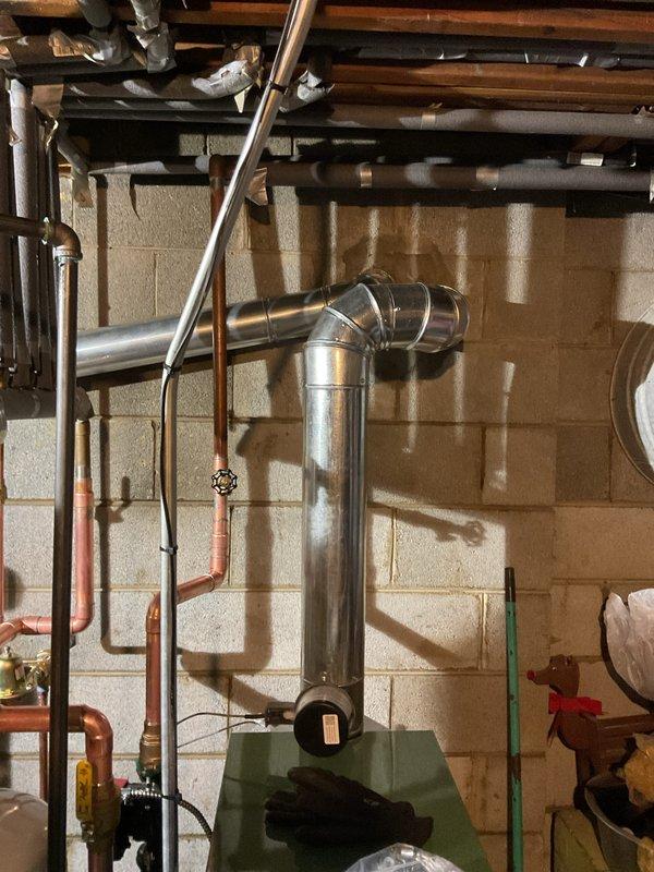 Successfully installed a new boiler and 40-gallon hot water heater in customer's basement utility room. Completed all mechanical and electrical connections, including proper venting with metal exhaust pipe connected to the existing flue system. All necessary permits have been requested for the installation.