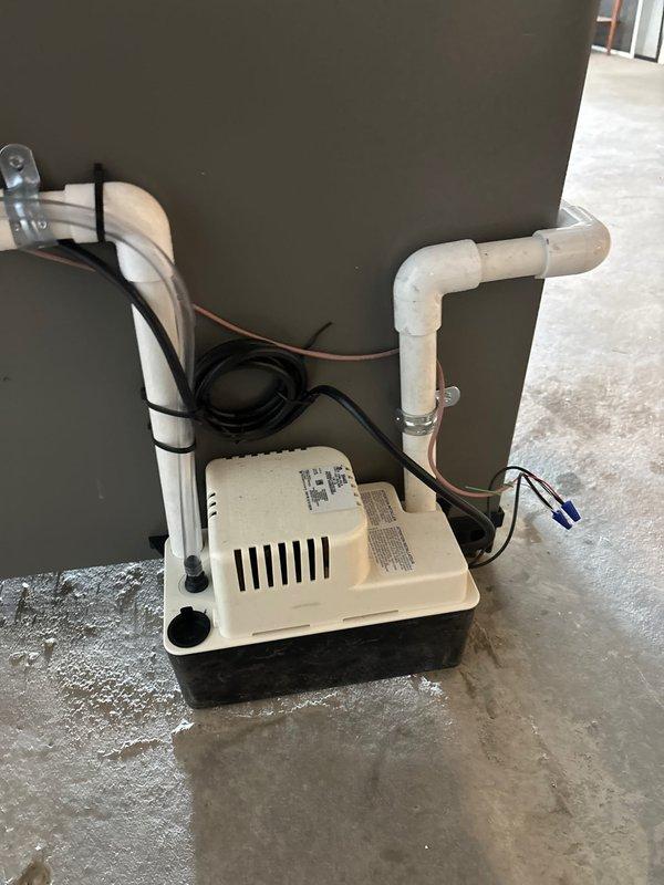 Completed installation of a 70,000 BTU furnace and 2.5-ton AC system with accompanying 600m humidifier and APCO UV air purification unit. Installed condensate pump with proper PVC drainage lines and secured electrical connections. System includes new black iron gas piping with brass shut-off valve and appropriate thread sealant for safety compliance.