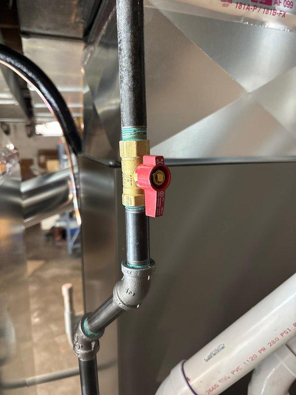 Completed installation of a 70,000 BTU furnace and 2.5-ton AC system with accompanying 600m humidifier and APCO UV air purification unit. Installed condensate pump with proper PVC drainage lines and secured electrical connections. System includes new black iron gas piping with brass shut-off valve and appropriate thread sealant for safety compliance.