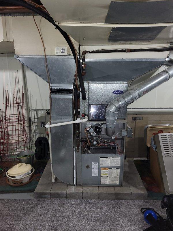 Performed comprehensive evaluation of 25-year-old HVAC system located in residential basement. Diagnosed multiple critical failures including failed heat exchanger, locked inducer motor, and weak blower motor capacitor in the 2005 furnace/AC system. Provided detailed estimate for complete system replacement of both furnace and air conditioning unit, documenting existing installation configuration and ductwork layout for proper replacement specifications.