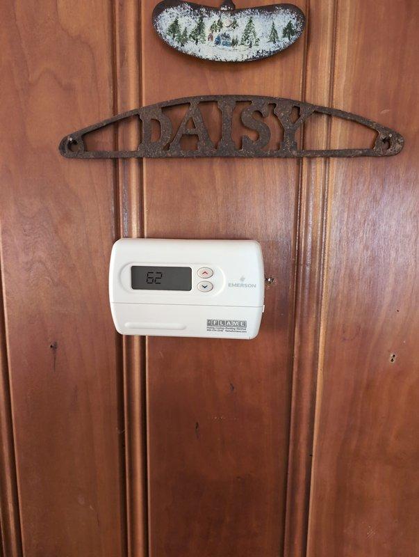 Successfully installed a Navien combi boiler system with complete mechanical, plumbing, and electrical connections. System includes properly installed PVC venting through the attic space and a new Emerson digital thermostat programmed for optimal temperature control.