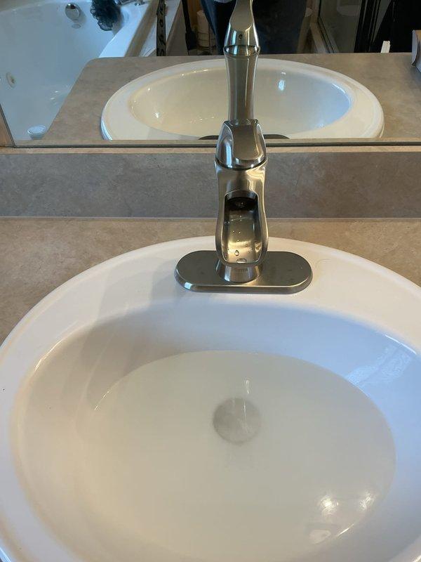 Successfully installed two customer-supplied faucets in bathroom sinks. Both installations were completed with proper fitting and connection to existing plumbing, ensuring no leaks. The new contemporary single-handle faucets with brushed nickel finish are now fully operational.