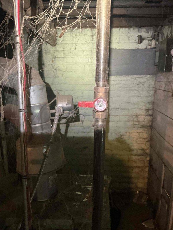 Responded to service call for non-operational boiler that would burn but not produce heat. Upon inspection of the aged unit (10+ years), found significant deterioration in the mechanical area including pipe corrosion, extensive cobwebs, and moisture issues in the basement. Determined system requires comprehensive maintenance and potential replacement of damaged components to restore proper heating function.