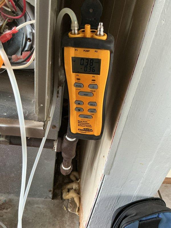 Responded to service call for intermittently functioning forced air furnace (approximately 8+ years old). Conducted comprehensive diagnostic testing using Fieldpiece pressure measurement device and Testo 310 combustion analyzer to verify system operation parameters. Readings indicated pressure values of 0.049/-0.036 and combustion efficiency values of 5.7/1.14, resolving the intermittent operation issue through appropriate adjustments to restore reliable heating function.