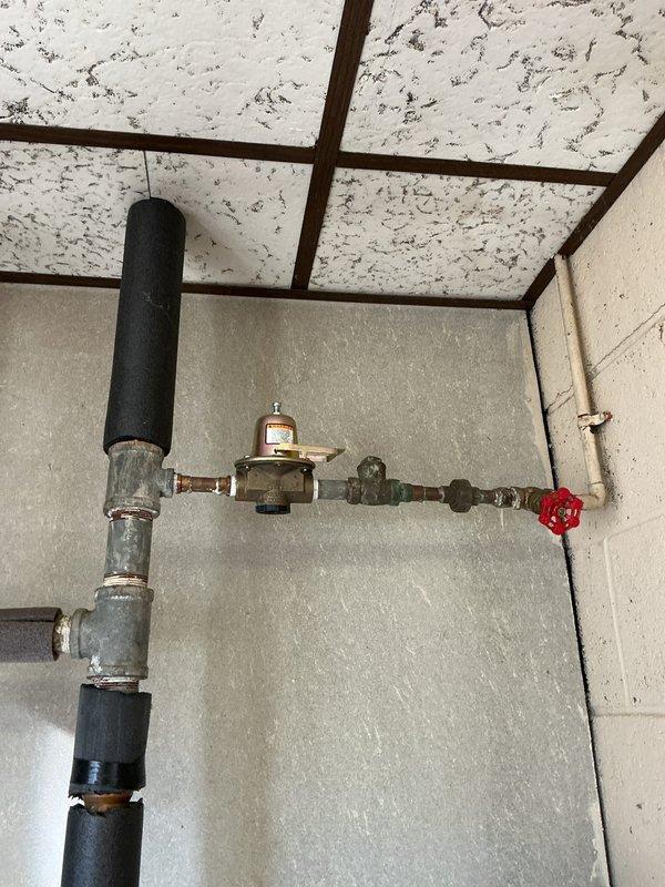 Performed Gold Boiler Inspection on 21-year-old hot water boiler located in basement. System was operational with proper pressure readings observed. Inspected plumbing connections, insulation integrity on pipes, and verified functionality of shut-off valves and control module.